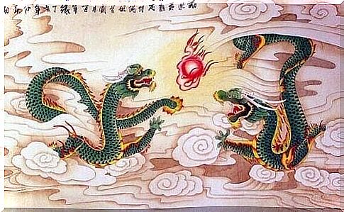 Two green dragons breathe fire