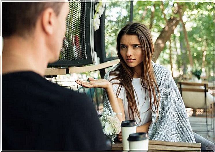 A couple arguing at the cafe