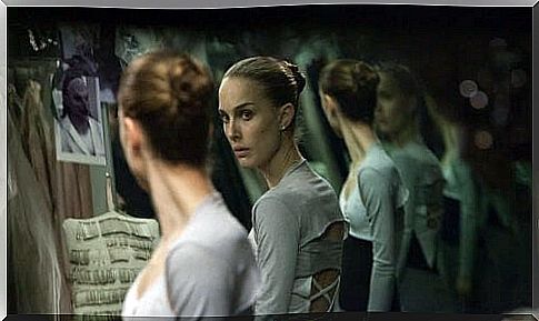 Ballerina sees herself in the mirror.