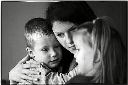 Mother hugs child