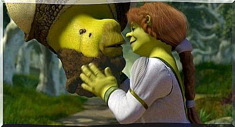 Shrek kisses Fiona.