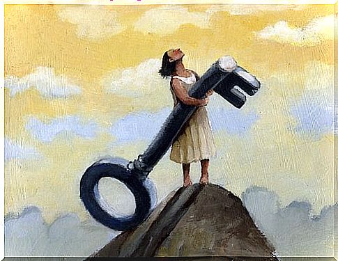 Woman holding a key on a mountain top