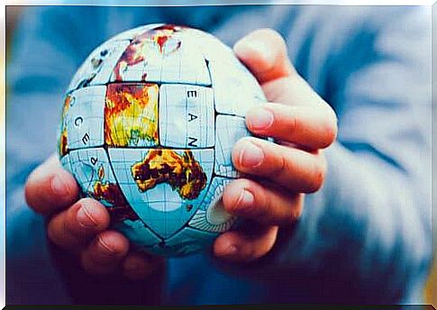 Man holding a globe.