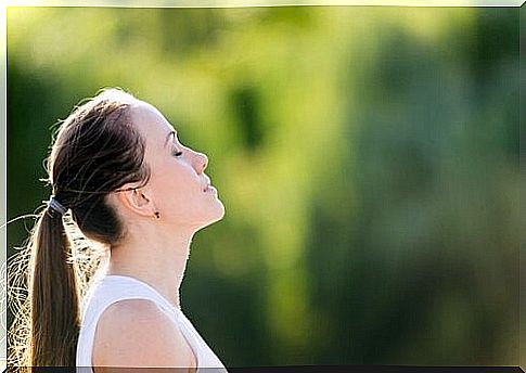 Woman performing breathing exercises