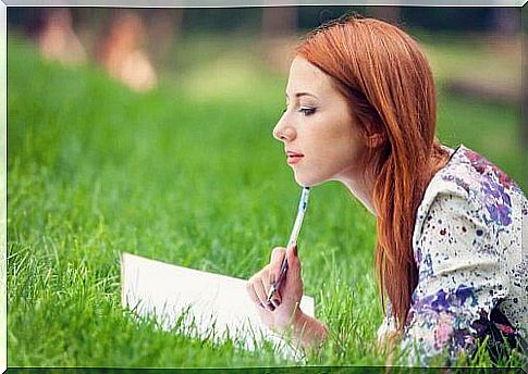 Woman writing to prevent wandering thoughts