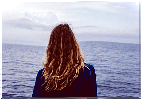 Woman looking out to sea.