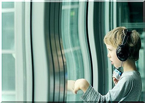 Little boy with aspergers listening to music