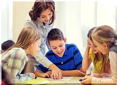 A teacher with young students.